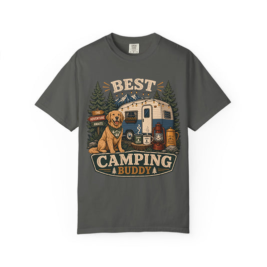 A dark gray crewneck t-shirt featuring a vintage-style graphic print of a golden retriever dog sitting next to a retro camping trailer, with the text 'BEST CAMPING BUDDY' and camping elements like lanterns and mugs.